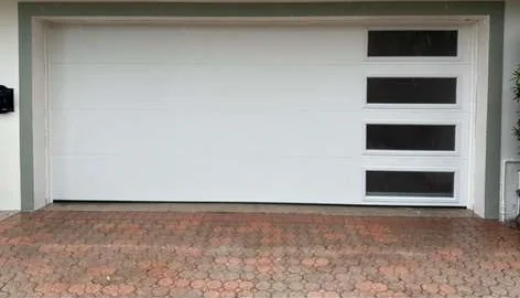 Modern contemporary flush garage door with vertical right-aligned tinted window panels