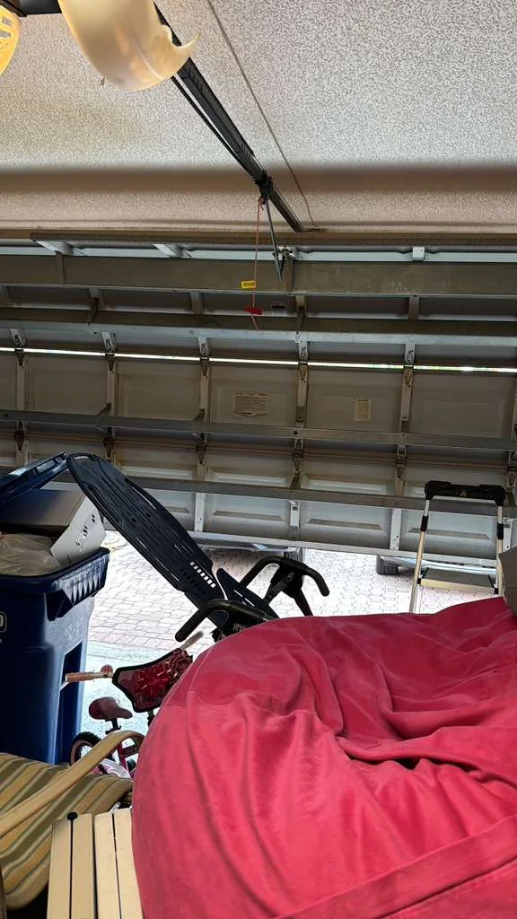 Interior view of garage door with horizontal hurricane struts and trolley operator arm