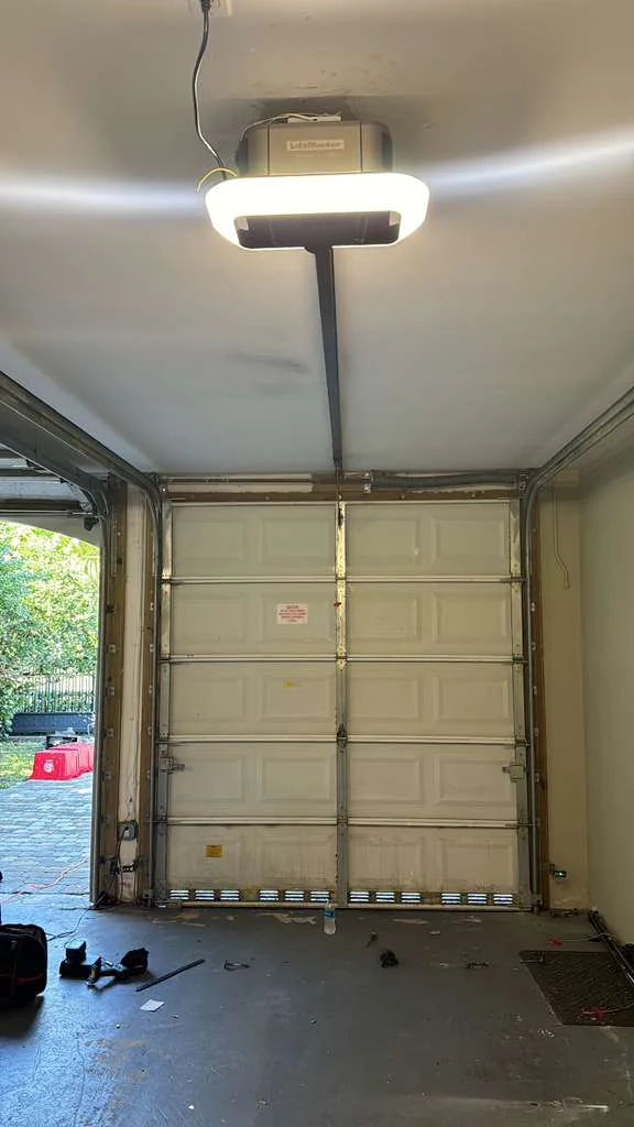 LiftMaster smart belt-drive opener with glowing LED ring installed on ceiling