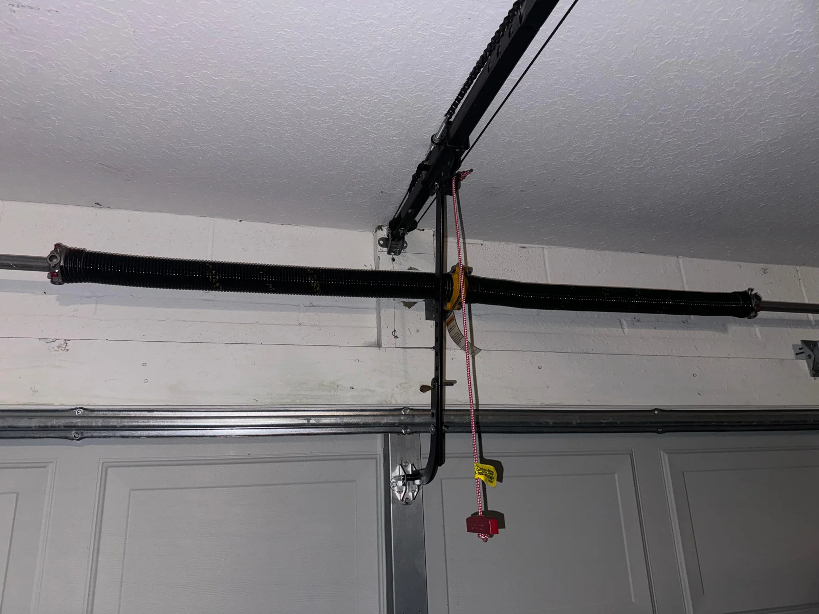 Dual high-cycle galvanized torsion springs installed with center bearing plate