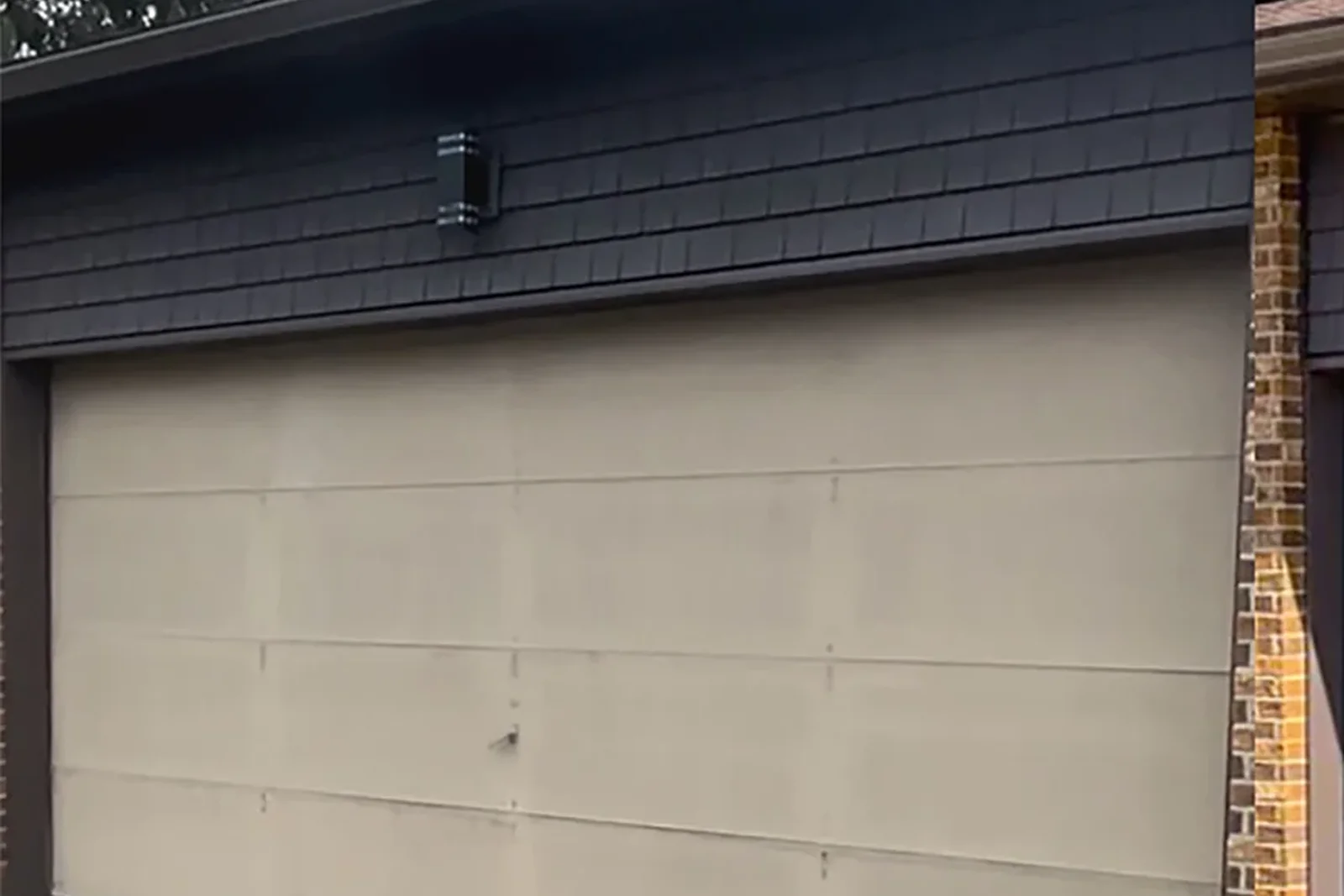 Dated garage door before replacement