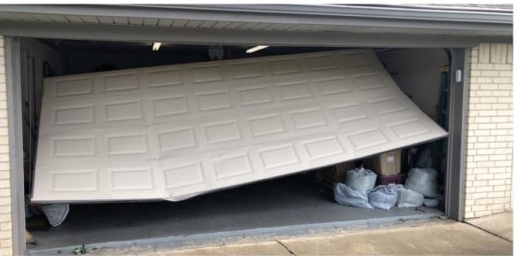 WHITE BEFORE broken garage door