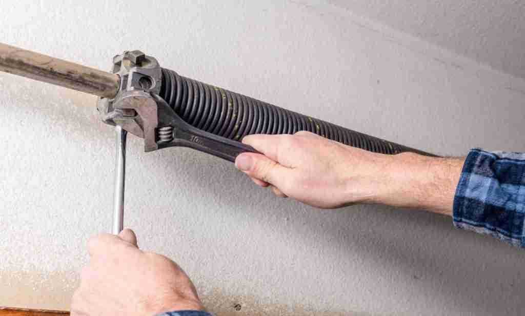 Repair garage door torsion spring